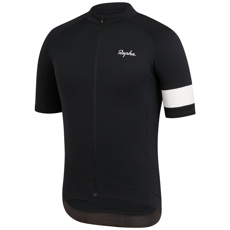 Cycling jerseys hanging on a rail in a range of colours